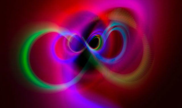 alt="colorful infinity symbol spinning"
